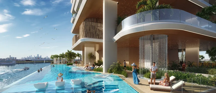 Waterfront infinity pool at Hilton Residences Dubai Maritime City looking out to the Gulf and the city skyline
